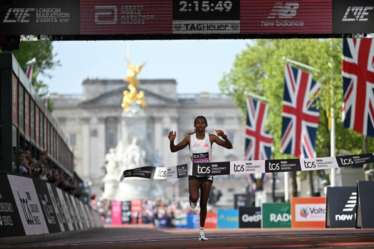 Ethiopia's Tigst Assefa crosses the line to win the women's race at the 2025 London Marathon in central London on April 27, 2025. JUSTIN TALLIS / AFP