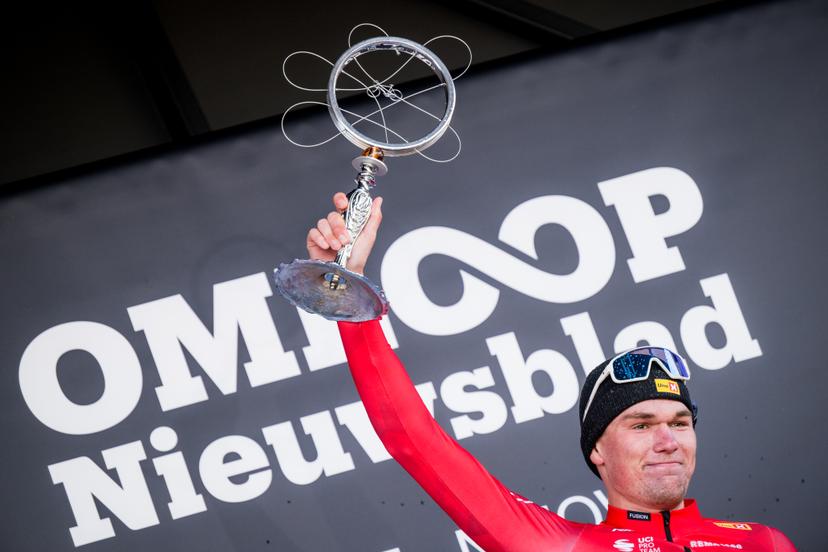 Norwegian Soren Waerenskjold of Uno-X Mobility celebrates on the podium after winning the men's one-day cycling race Omloop Het Nieuwsblad (UCI World Tour), 197 km from Gent to Ninove, Saturday 01 March 2025. BELGA PHOTO JASPER JACOBS