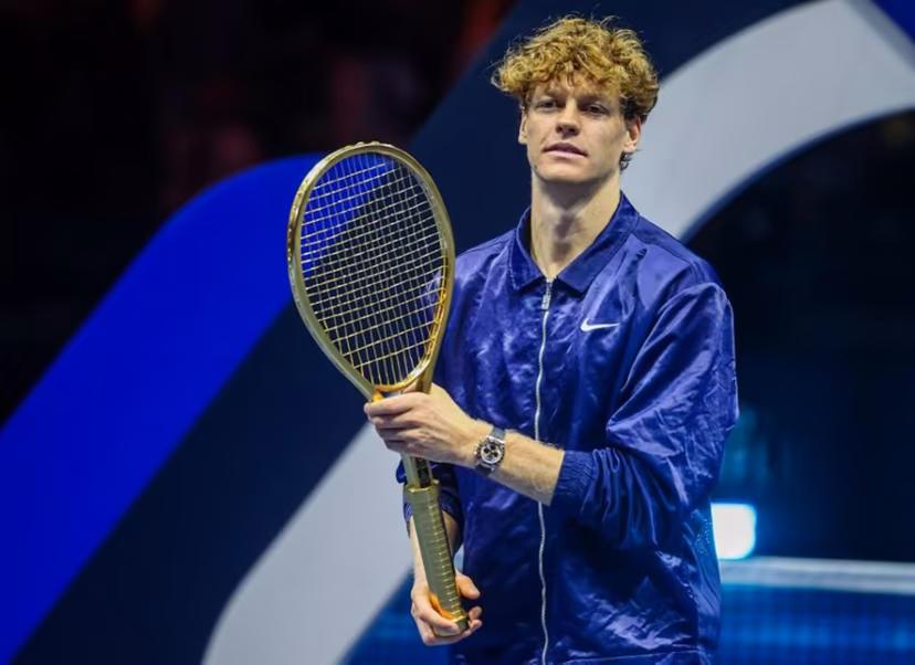 Italy's Jannik Sinner holds up his winning trophy, the Golden Racquet, after defeating Spain's Carlos Alcaraz in the final of the Six Kings Slam exhibition tennis tournament in Riyadh on October 18, 2025. Fayez NURELDINE / AFP