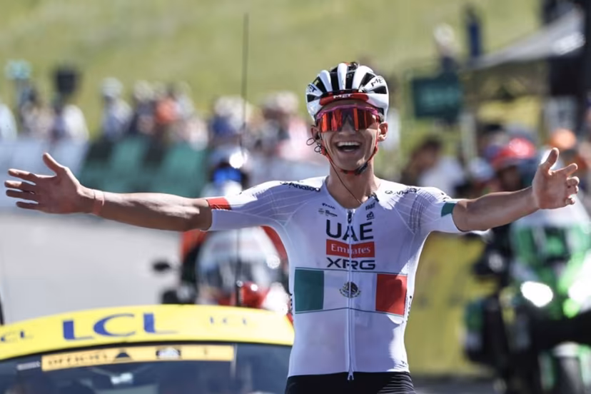 UAE Team Emirates XRG's Mexican rider Isaac Del Toro Romero celebrates as he cycles to the finish line to win the 8th and final stage of the Tour Auvergne-Rhone-Alpes cycling race (formerly known as the Criterium du Dauphine), 120,1km between Beaufort and Plateau de Solaison, in the French Alps on June 14, 2026. Anne-Christine POUJOULAT / AFP