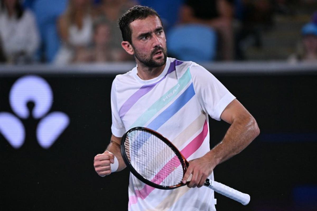 Croatia's Marin Cilic reacts after a point against Norway's Casper Ruud during their men's singles match on day seven of the Australian Open tennis tournament in Melbourne on January 24, 2026. WILLIAM WEST / AFP