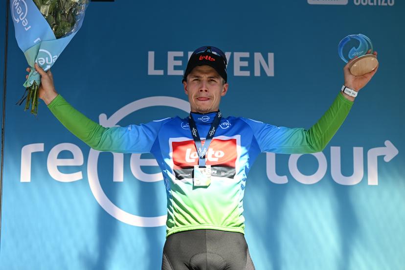 Belgian Arnaud De Lie of Lotto Cycling Team celebrates on the podium in the leader's jersey after winning the fifth and last stage of the 'Renewi Tour' multi-stage cycling race, 185km from and to Leuven on Sunday 24 August 2025. The five-day race takes place in Belgium and the Netherlands. BELGA PHOTO DAVID PINTENS