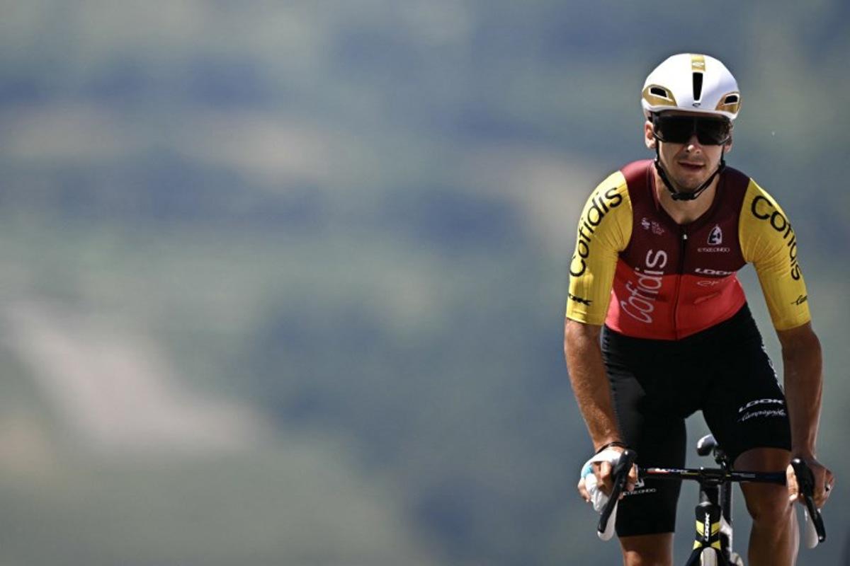 Cofidis team's French rider Bryan Coquard cycles to the finish line of the 13th stage of the 112th edition of the Tour de France cycling race, 10.9 km individual time trial between Loudenvielle and Peyragudes, in the Pyrenees mountains of southwestern France, on July 18, 2025. Loic VENANCE / AFP