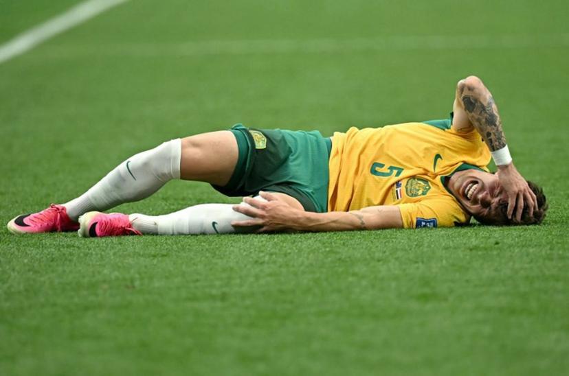 Australia's defender #05 Jordan Bos reacts on the ground during the 2026 World Cup round of 32 football match between Australia and Egypt at the Dallas Stadium in Arlington on July 3, 2026. Paul ELLIS / AFP