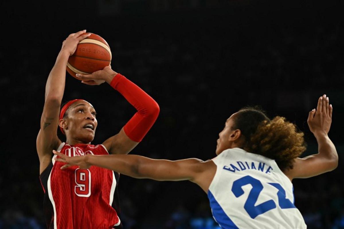USA's #09 A'ja Wilson takes a shot over France's #22 Marieme Badiane in the women's Gold Medal basketball match between France and the USA during the Paris 2024 Olympic Games at the Bercy Arena in Paris on August 11, 2024. Paul ELLIS / AFP