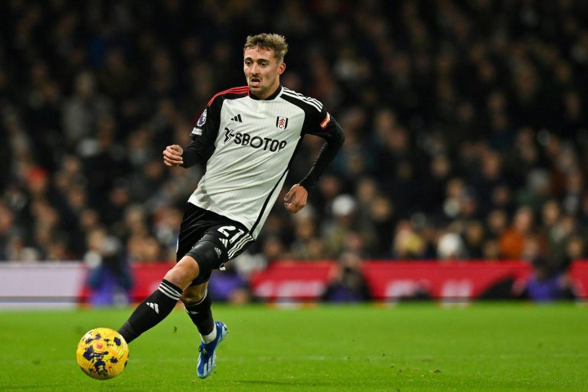 Fulham's Belgian defender #21 Timothy Castagne controls the ball during the English Premier League football match between Fulham and Wolverhampton Wanderers at Craven Cottage, in London, on November 27, 2023. Glyn KIRK / AFP