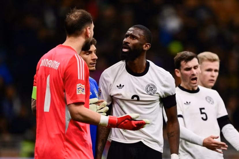 Italy's goalkeeper #01 Gianluigi Donnarumma argues with Germany's defender #02 Antonio Rudiger during the Nations League quarter final first leg football match between Italy and Germany at the San Siro Stadium in Milan, on March 20, 2025. Marco BERTORELLO / AFP
