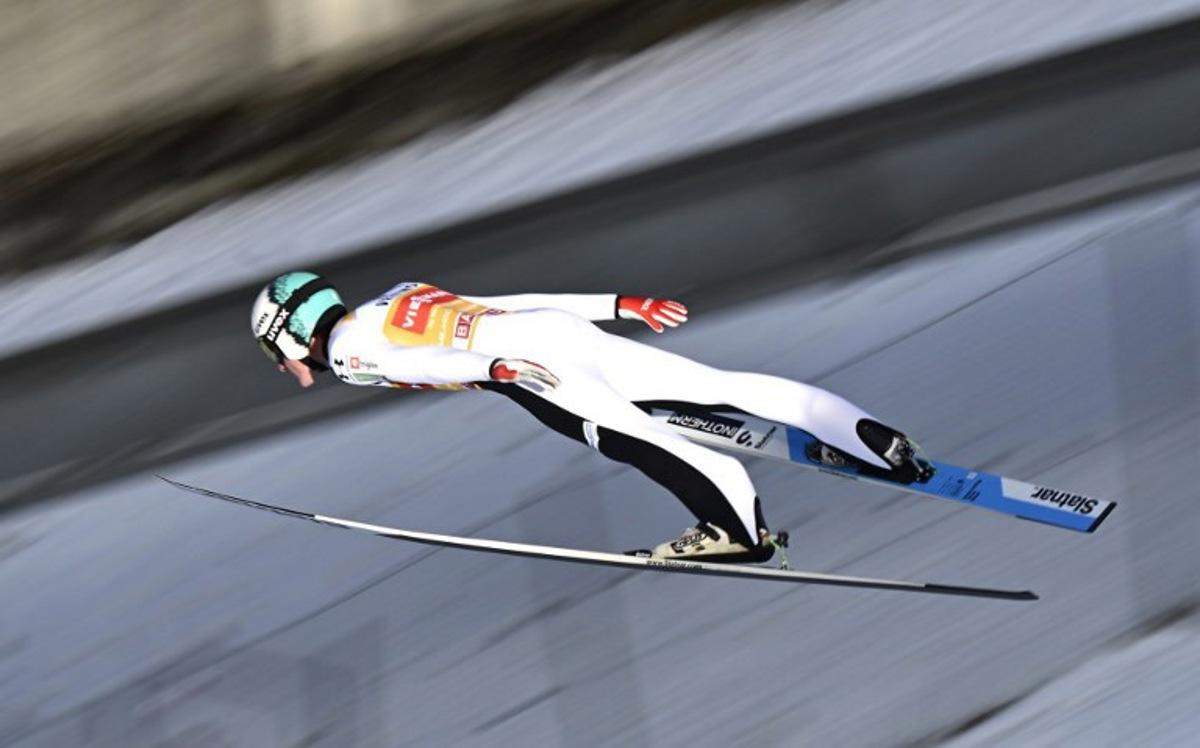 Slovenia's Domen Prevc soars through the air during the trial round ahead of the Men's Individual Large Hill HS142 event of the FIS Ski Jumping World Cup, the second leg of the Four Hills Tournament, in Garmisch-Partenkirchen, southern Germany on January 1, 2026. PHILIPP GUELLAND / AFP