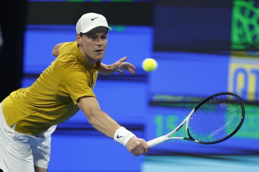 Italy's Jannik Sinner hits a return against Czech Republic's Jakub Mensik during their men's singles quarterfinal match at the Qatar Open tennis tournament in Doha on February 19, 2026. Karim JAAFAR / AFP