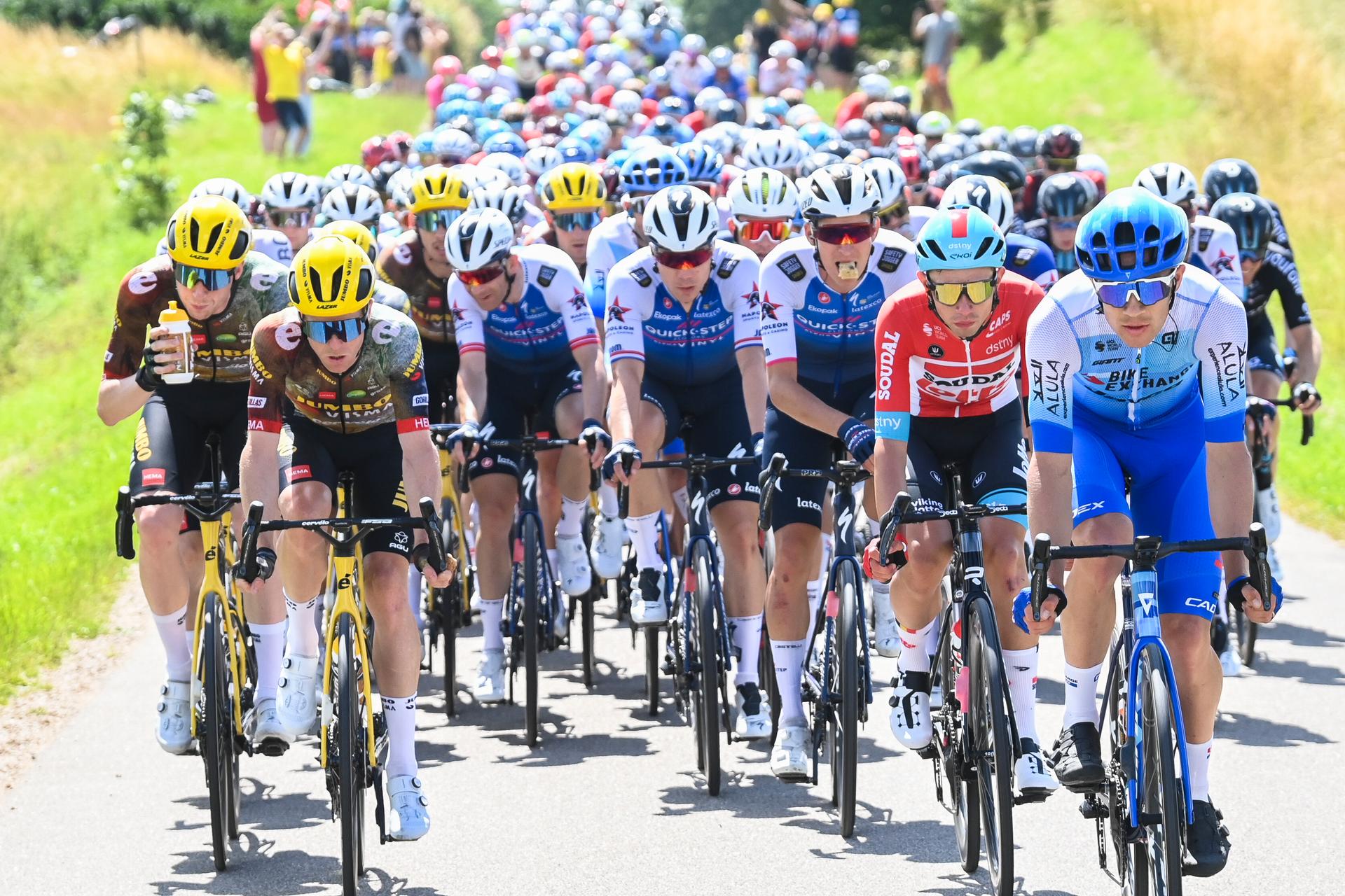 Illustration picture shows the pack of riders in action during the second stage of the Tour de France cycling race, a 202,2 km race between Roskilde and Nyborg, Denmark, Saturday 02 July 2022. This year's Tour de France takes place from 01 to 24 July 2022 and starts with three stages in Denmark. BELGA PHOTO DAVID STOCKMAN