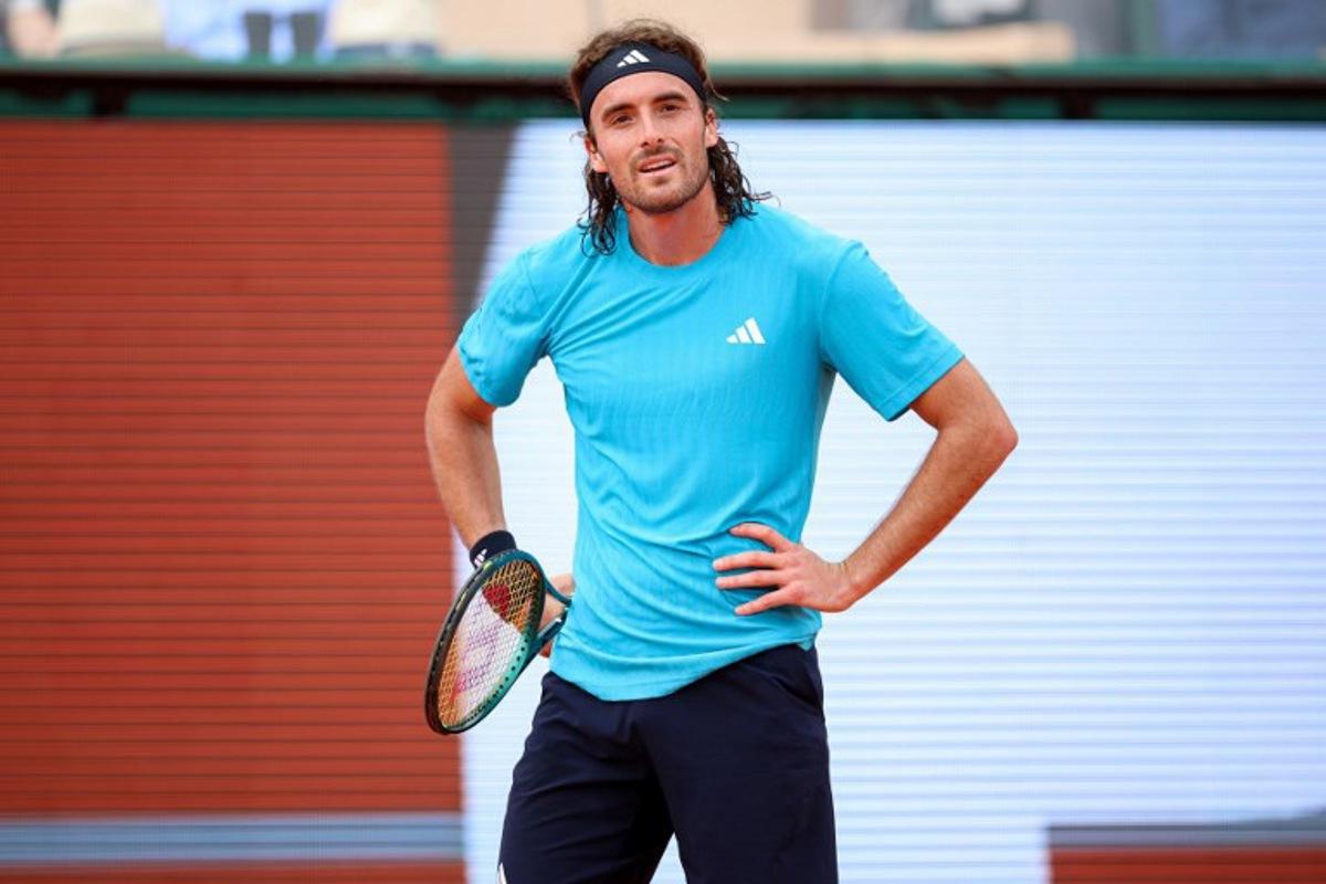 Greece's Stefanos Tsitsipas reacts as he plays against Argentinia's Francisco Cerundolo during the Monte Carlo ATP Masters Series Tournament round of 64 tennis match on Court Rainier III at the Monte-Carlo Country Club in Roquebrune-Cap-Martin, south-eastern France on April 6, 2026. Valery HACHE / AFP