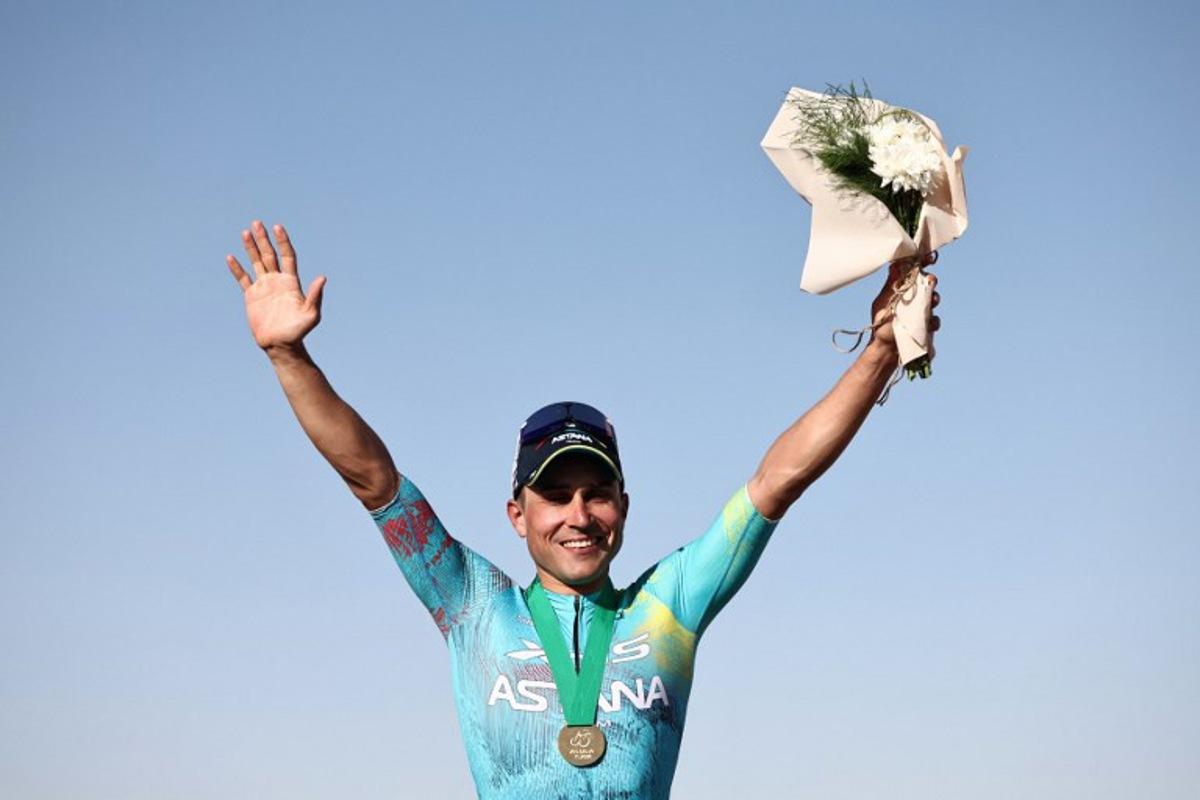 XDS Astana Team italian Matteo Malucelli celebrates on the podium after winning the fourth stage of the AlUla Tour cycling race, 173,4 km from Winter Park to Hegra on January 30, 2026. Anne-Christine POUJOULAT / AFP