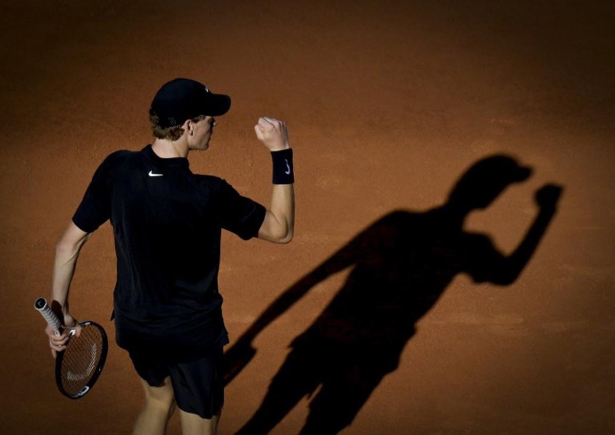 Italy's Jannik Sinner celebrates a point against Norway's Casper Ruud during the men's final of the ATP Rome Open tennis tournament at Foro Italico in Rome on May 17, 2026. TIZIANA FABI / AFP