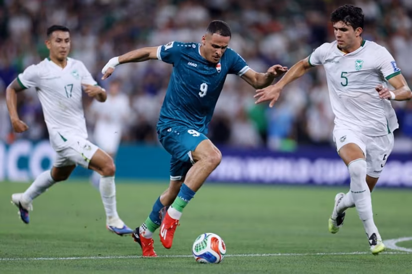 Iraq's forward #09 Ali Al-Hamadi and Bolivia's defender #05 Efrain Morales fight for the ball during the 2026 FIFA World Cup qualifiers final playoff football match between Iraq and Bolivia at the BBVA Stadium in Guadalupe, Nuevo Leon state, Mexico, on March 31, 2026. Julio Cesar AGUILAR / AFP
