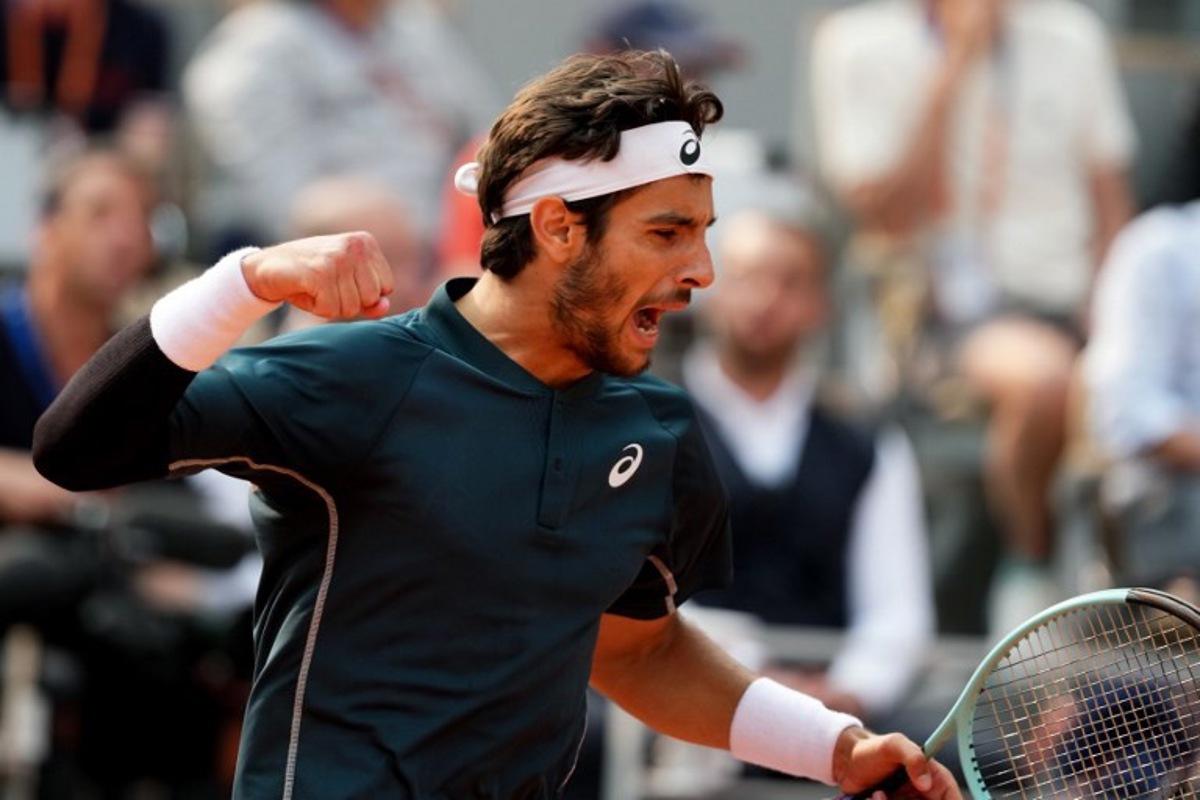 Italy's Lorenzo Musetti reacts after a point during his men's singles quarter-final match against US Frances Tiafoe on day 10 of the French Open tennis tournament on Court Philippe-Chatrier at the Roland-Garros Complex in Paris on June 3, 2025. Dimitar DILKOFF / AFP