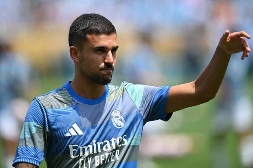 Real Madrid's Spanish midfielder #19 Dani Ceballos warms up ahead of the FIFA Club World Cup 2025 Group H football match between Spain's Real Madrid and Mexico's Pachuca at the Bank of America stadium in Charlotte on June 22, 2025. Paul ELLIS / AFP