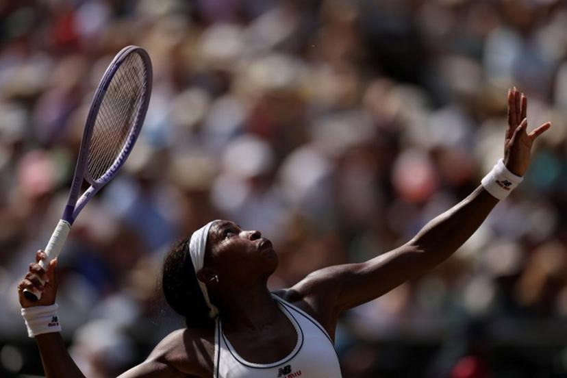 US player Coco Gauff serves to Czech Republic's Karolina Muchova during their women's singles semi-final tennis match on the eleventh day of the 2026 Wimbledon Championships at The All England Lawn Tennis and Croquet Club in Wimbledon, southwest London, on July 9, 2026. Adrian Dennis / AFP