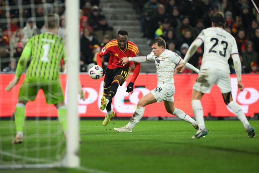 Belgium's forward #14 Dodi Lukebakio shoots during the FIFA World Cup 2026 Group J European qualification football match between Belgium and Liechtenstein at the Maurice-Dufrasne stadium, in Liege, on November 18, 2025. NICOLAS TUCAT / AFP