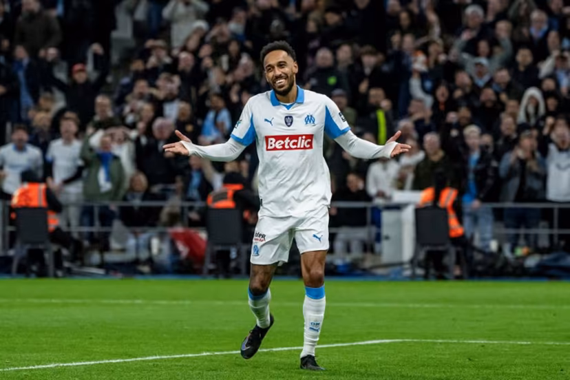 Marseille's Gabonese forward #17 Pierre-Emerick Aubameyang celebrates scoring his team's third goal during the French Cup round of 16 football match between Olympique de Marseille (OM) and Stade Rennais at the Stade Velodrome in Marseille, southern France, on February 3, 2026. MIGUEL MEDINA / AFP
