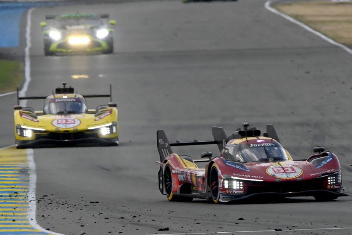 Ferrari AF Corse Thor Team's hypercar #51 Italian driver Antonio Gioninazzi (R) and Ferrari AF Corse Thor Team's hypercar #83 Polish driver Robert Kubica compete in the 24 Hours of Le Mans 2025, at the Le Mans circuit, north-western France, on June 15, 2025. JEAN-FRANCOIS MONIER / AFP