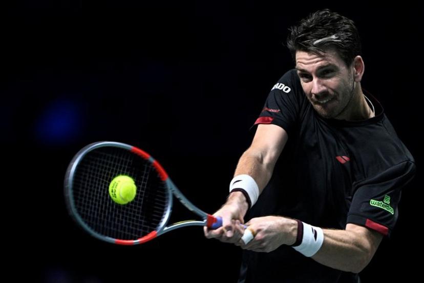 Britain's Cameron Norrie plays a backhand return to Monaco's Valentin Vacherot during their men's singles match on day four of the Paris ATP Masters 1000 tennis tournament at the Paris La Défense Arena in Nanterre, on the outskirts of Paris, on October 30, 2025. JULIEN DE ROSA / AFP