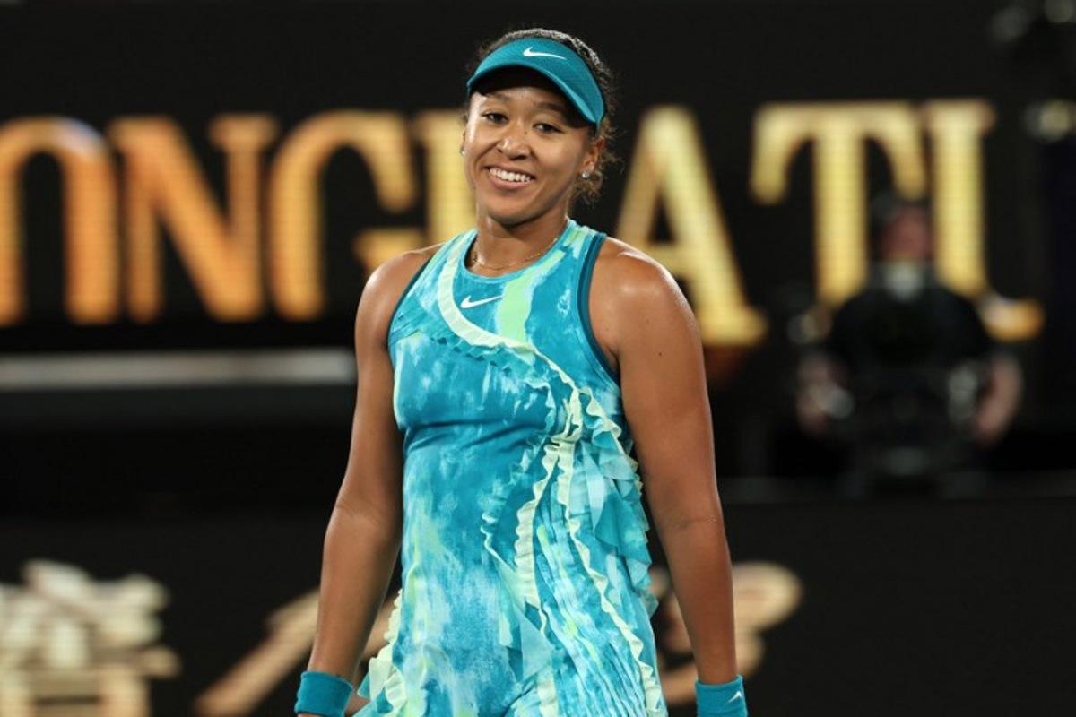 Japan's Naomi Osaka smiles as she celebrates beating Croatia's Antonia Ruzic in their women's singles match on day three of the Australian Open tennis tournament in Melbourne on January 20, 2026. IZHAR KHAN / AFP
