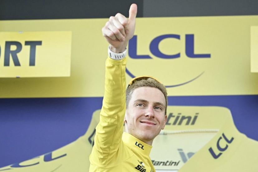 UAE Team Emirates - XRG's Slovenian rider Tadej Pogacar celebrates on the podium with the overall leader's yellow jersey after the 13th stage of the 113th edition of the Tour de France cycling race, 205,8 km between Dole and Belfort in eastern France, on July 17, 2026. Loic VENANCE / AFP