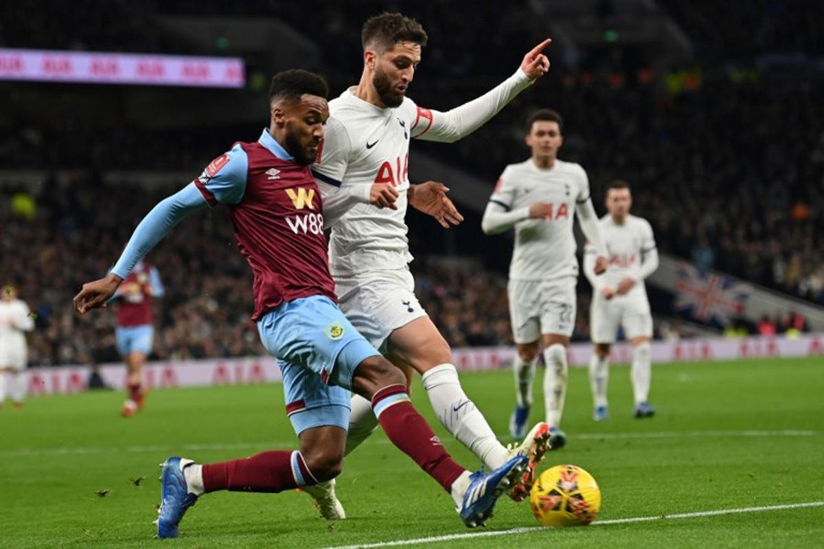 Burnley's Belgian defender #44 Hannes Piterson Delcroix (L) vies with Tottenham Hotspur's Uruguayan midfielder #30 Rodrigo Bentancur (C) during the English FA Cup third round football match between Tottenham Hotspur and Burnley at Tottenham Hotspur Stadium in London, on January 5, 2024. Glyn KIRK / AFP