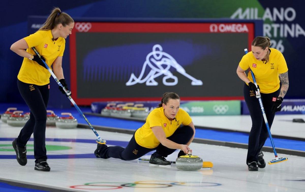 Sweden's Agnes Knochenhauer delivers the stone in the curling women's round robin gold medal game between Switzerland and Sweden during the Milano Cortina 2026 Winter Olympic Games at the Cortina Curling Olympic Stadium in Cortina d'Ampezzo on February 22, 2026. Odd ANDERSEN / AFP