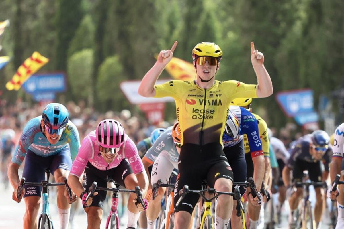 Team Visma-Lease a bike's British rider Matthew Brennan celebrates as he crosses the finish line to win the fifth stage of the Vuelta a Espana 2026, a 173,4 km race between Falset and Roquetes on August 26, 2026. Josep LAGO / AFP