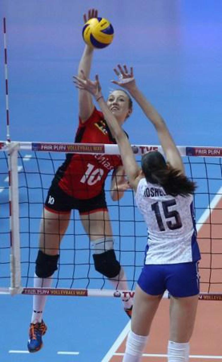 Tatiana Kosoleva (R) of Russ?a jumps for the ball with Lise Van Hecke (L) of Belg?um during the Women's European Olympic Qualification volleyball match between Russia and Belgium at the TVF Baskent Sports Hall in Ankara, on January 7, 2016. / AFP / ADEM ALTAN