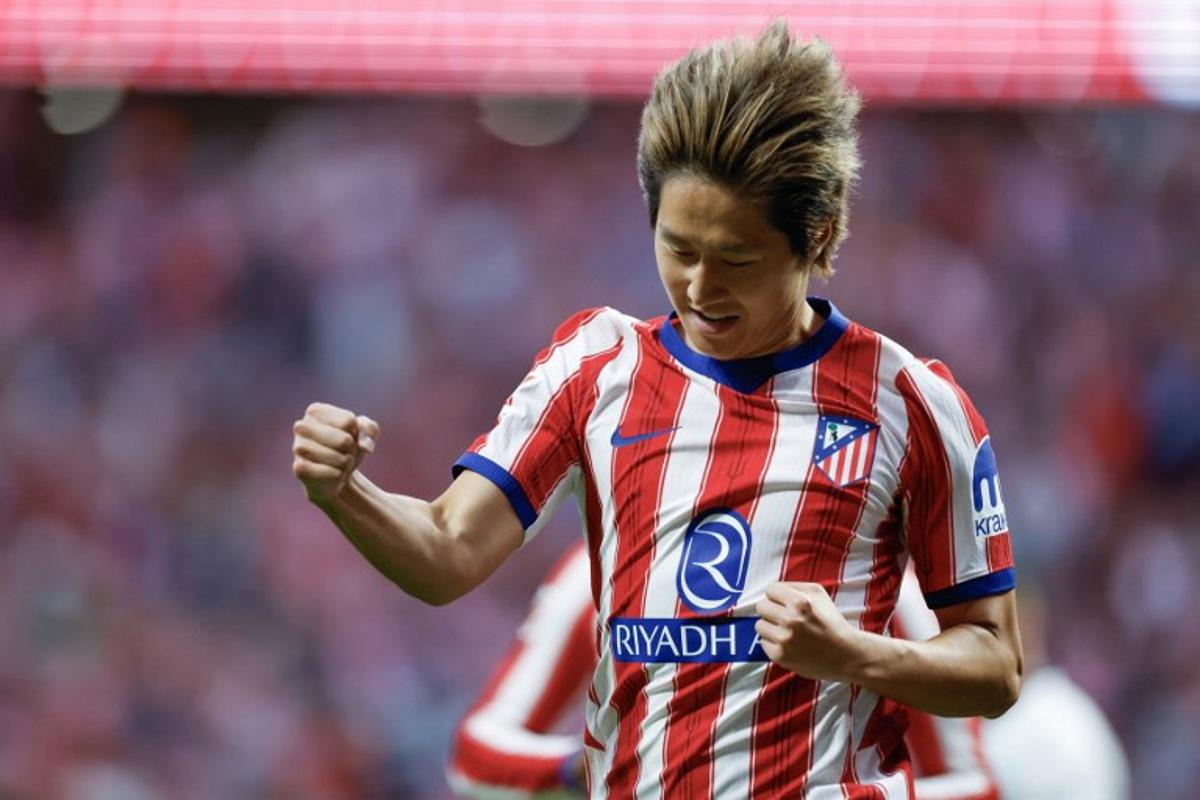 Atletico Madrid's South Korean midfielder #07 Kang-In Lee celebrates scoring his team's second goal during the Spanish league football match between Club Atletico de Madrid and CA Osasuna at the Metropolitano stadium in Madrid on September 16, 2026. Oscar DEL POZO / AFP