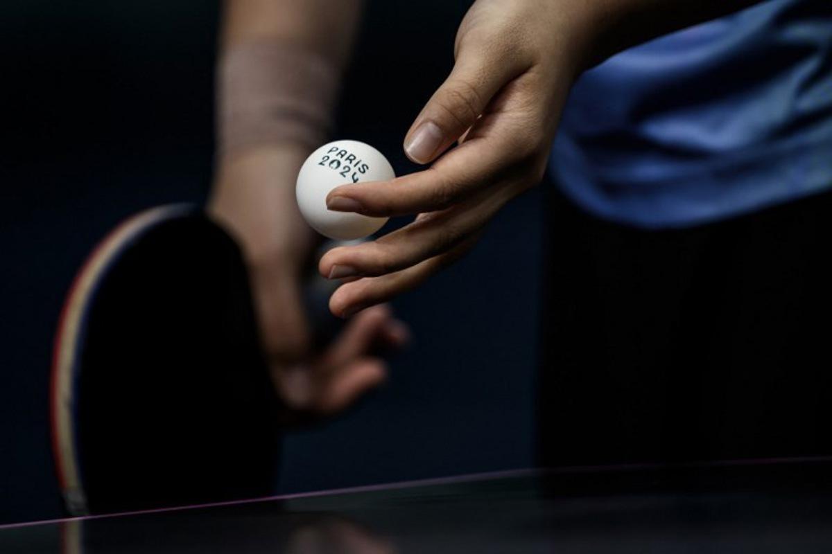 South Korea's Shin Yubin prepares to serve to Japan's Miu Hirano during their women's table tennis singles quarter-finals at the Paris 2024 Olympic Games at the South Paris Arena in Paris on August 1, 2024. JEFF PACHOUD / AFP