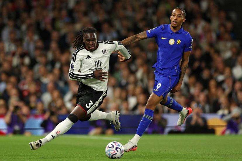 Fulham's Italian-born Nigerian defender #03 Calvin Bassey (L) runs away from Chelsea's Brazilian striker #09 Joao Pedro (R) during the English Premier League football match between Fulham and Chelsea at Craven Cottage in London on August 24, 2026. Adrian Dennis / AFP