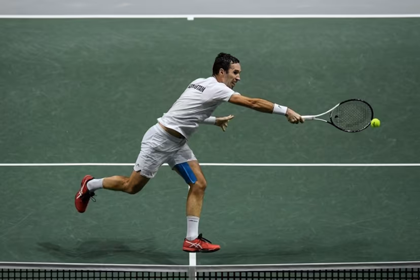 Kazakhstan's Mikhail Kukushkin returns the ball to Serbia's Miomir Kecmanovic during the men's singles quarter-final tennis match between Serbia and Kazakhstan of the Davis Cup tennis tournament at the Madrid arena in Madrid on December 1, 2021. OSCAR DEL POZO / AFP