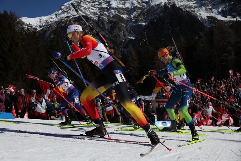 France's Oceane Michelon (L), Belgium's Maya Cloetens (C) and Slovenia's Anamarija Lampic (R) compete during the Women 10 km Pursuit event of the IBU Biathlon World Championship of Lenzerheide, eastern Switzerland, on February 16, 2025. FRANCK FIFE / AFP