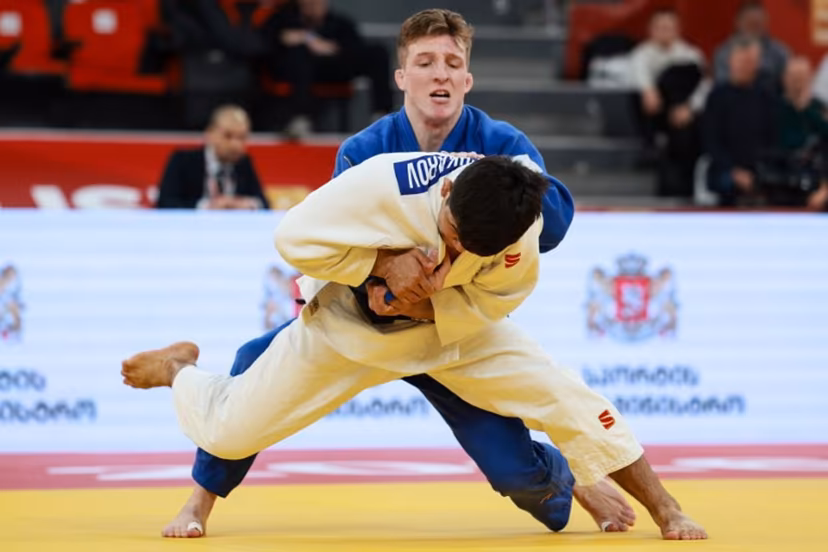 Uzbekistan's Samariddin Kuchkarov (white) competes against Belgium's Jorre Verstraeten in the men's under 60 kg bronze medal bout at the Tbilisi Grand Slam judo tournament in Tbilisi on March 20, 2026. Giorgi ARJEVANIDZE / AFP