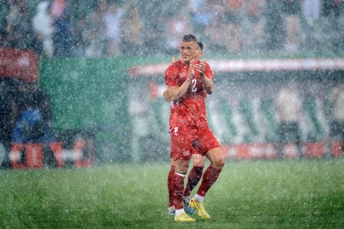 Switzerland's defender #2 Miro Muheim waves goodbye in the rain at the end of a friendly football match between Switzerland and Jordan ahead of the 2026 FIFA World Cup tournament at the Kybunpark in St. Gallen on May 31, 2026. Ennio LEANZA / AFP