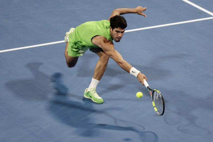 Spain's Carlos Alcaraz hits a return against France's Arthur Fils during their men's singles final match at the Qatar Open tennis tournament in Doha on February 21, 2026. Karim JAAFAR / AFP