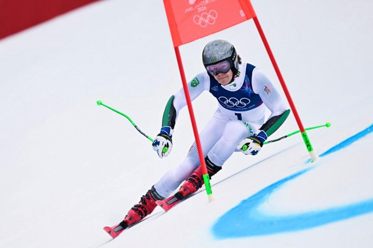 Brazil's Lucas Pinheiro Braathen passes a gate in the first run of the men's giant slalom alpine skiing event during the Milano Cortina 2026 Winter Olympic Games at the Stelvio Ski Centre in Bormio (Valtellina) on February 14, 2026. Fabrice COFFRINI / AFP