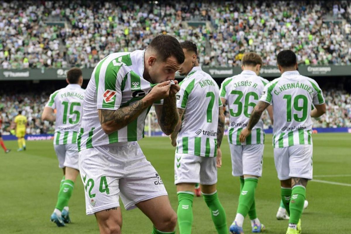 Real Betis' Spanish defender #24 Aitor Ruibal Garcia celebrates scoring their first goal during the Spanish league football match between Real Betis and Villarreal CF at the Benito Villamarin stadium in Seville on April 13, 2025. CRISTINA QUICLER / AFP