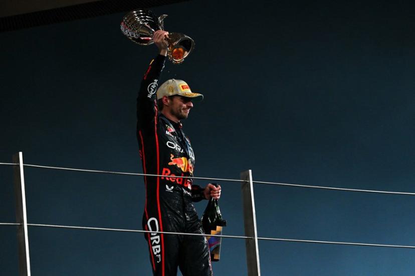 Race winner Red Bull Racing's Dutch driver Max Verstappen celebrates on the podium at the end of the Abu Dhabi Formula One Grand Prix at the Yas Marina Circuit in Abu Dhabi on December 7, 2025. Andrej ISAKOVIC / AFP