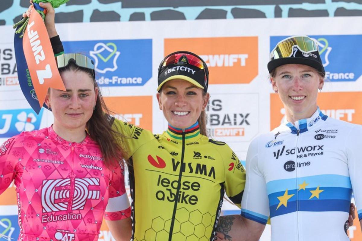 Second placed EF Education-Oatly's Italian rider Letizia Borghesi (L), First placed Team Visma-Lease a Bike's French rider Pauline Ferrand Prevot and SD Worx-Protime's Dutch rider Lorena Wiebes celebrate on the podium of the fifth edition of the Paris-Roubaix women's race, 148,5 km between Denain and Roubaix, northern France on April 12, 2025. Francois LO PRESTI / AFP