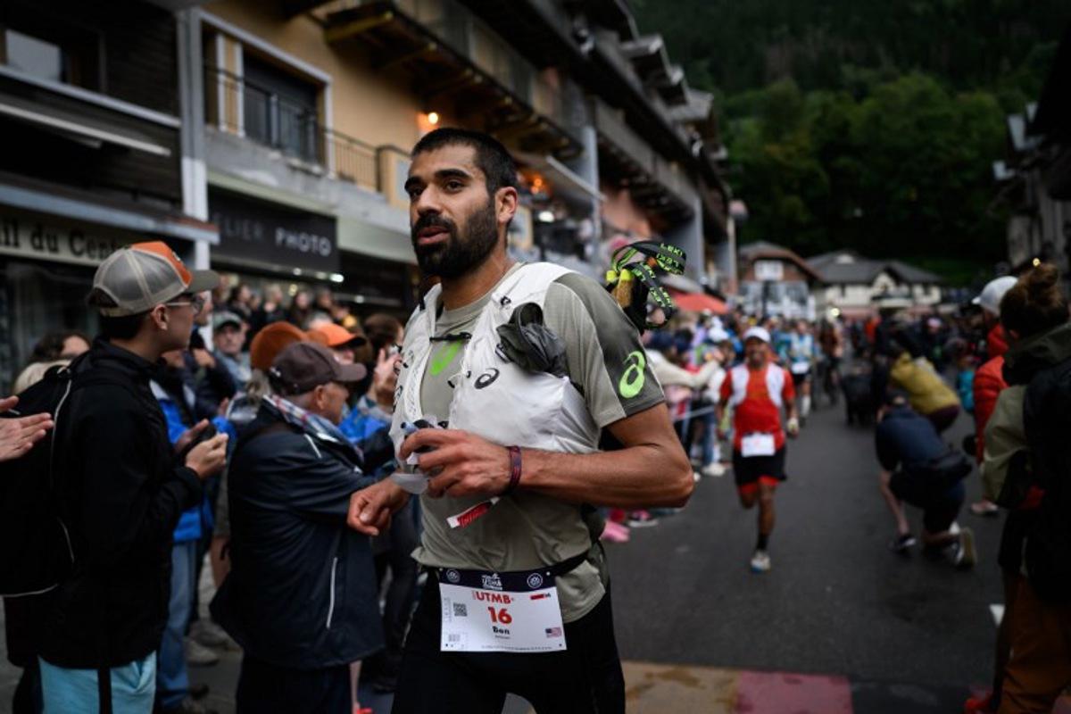 US trailer Ben Dhiman competes in the 22nd edition of the Ultra Trail du Mont Blanc (UTMB), a 174km trail race crossing France, Italy and Switzerland, in Chamonix, south-eastern France on August 29, 2025. JEFF PACHOUD / AFP