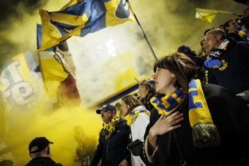 Supporters of Royale Union Saint-Gilloise celebrate after a goal during the Belgian Pro League playoff football match between Royale Union Saint-Gilloise and KRC Genk at the Joseph Marien Stadium in Brussels on May 3, 2025. Simon Wohlfahrt / AFP
