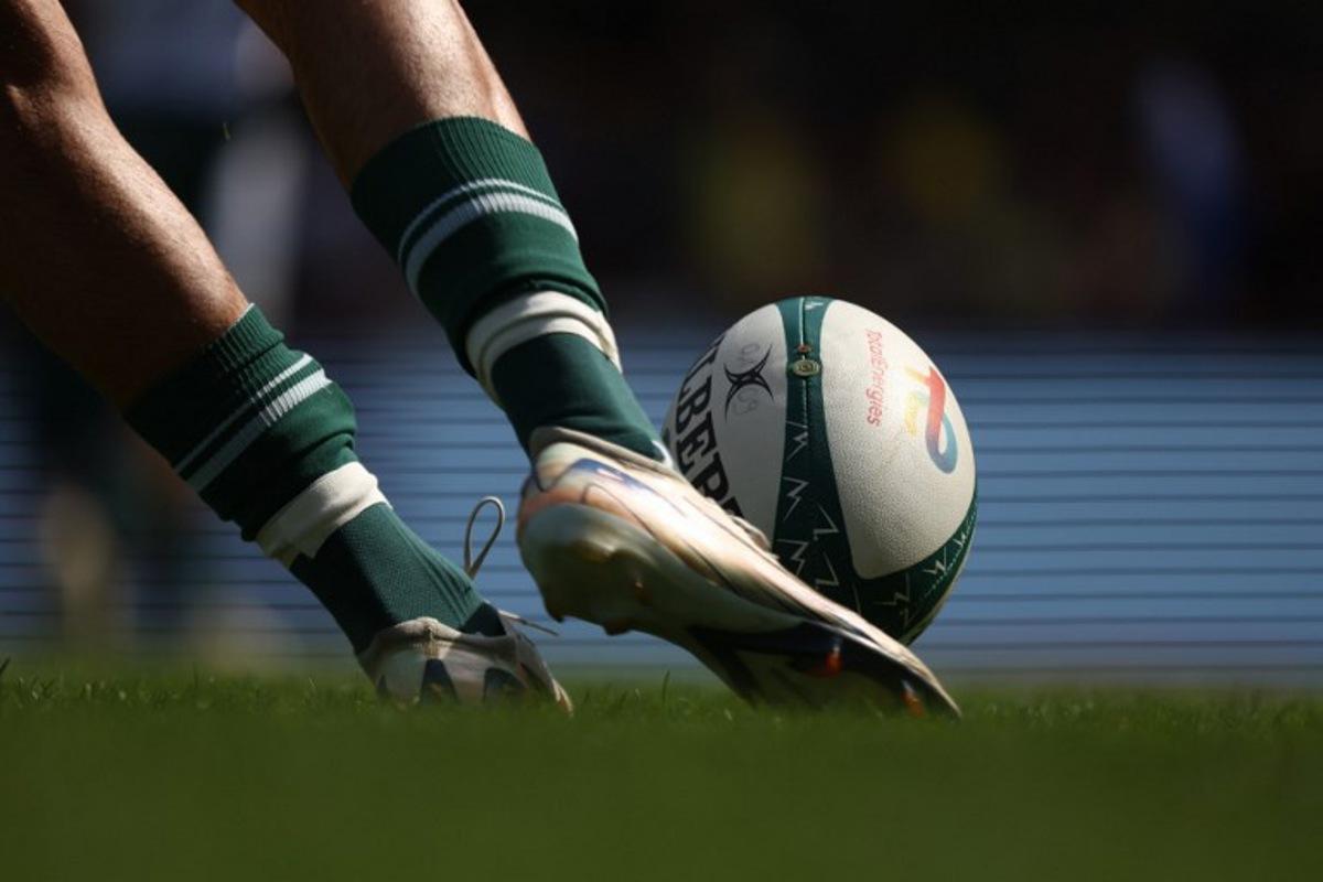 A player kicks the ball during the French Top 14 rugby union match between ASM Clermont Auvergne and Section Paloise Bearn Pyrenees (Pau) at the Marcel Michelin stadium in Clermont-Ferrand, central France on September 20, 2025. Alex MARTIN / AFP