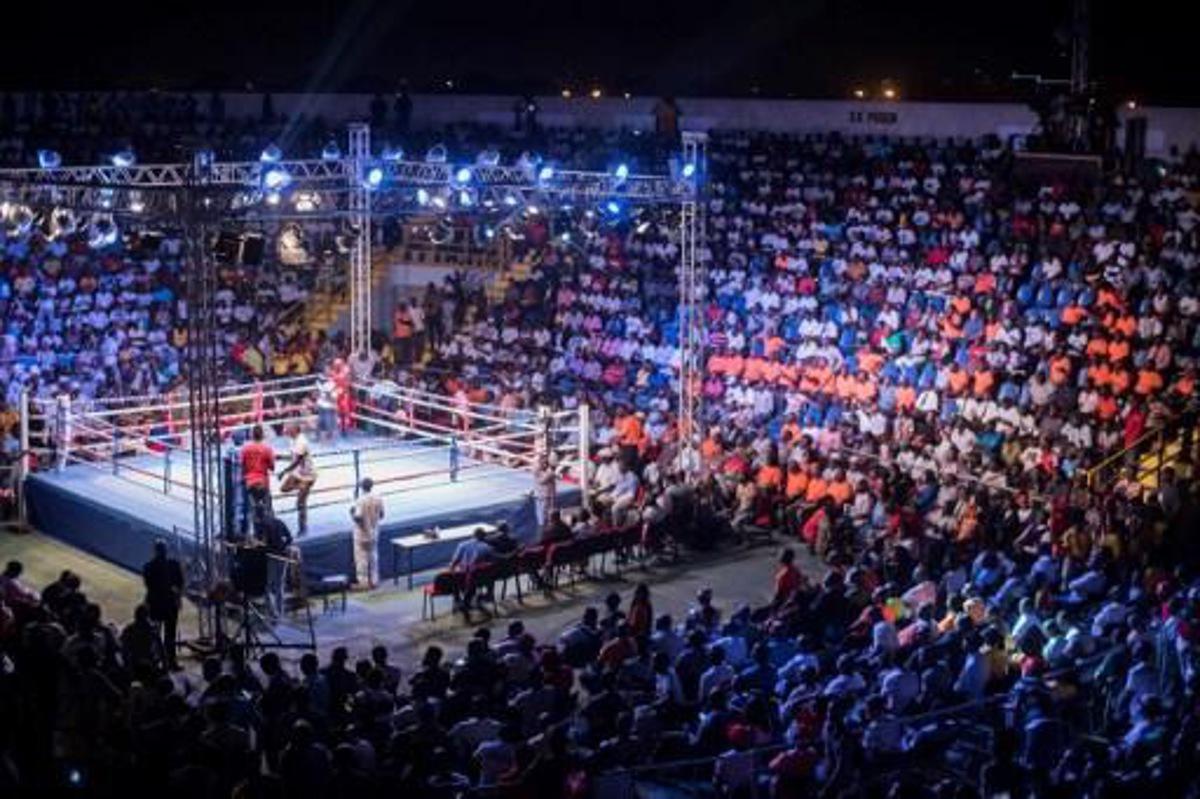 Fans attend the opening of the Bukom Boxing Arena, one of the buildings inside the Trust Sports Emporium complex with a capacity for more than 4000 people, in Accra, November 15, 2016.
CRISTINA ALDEHUELA / AFP