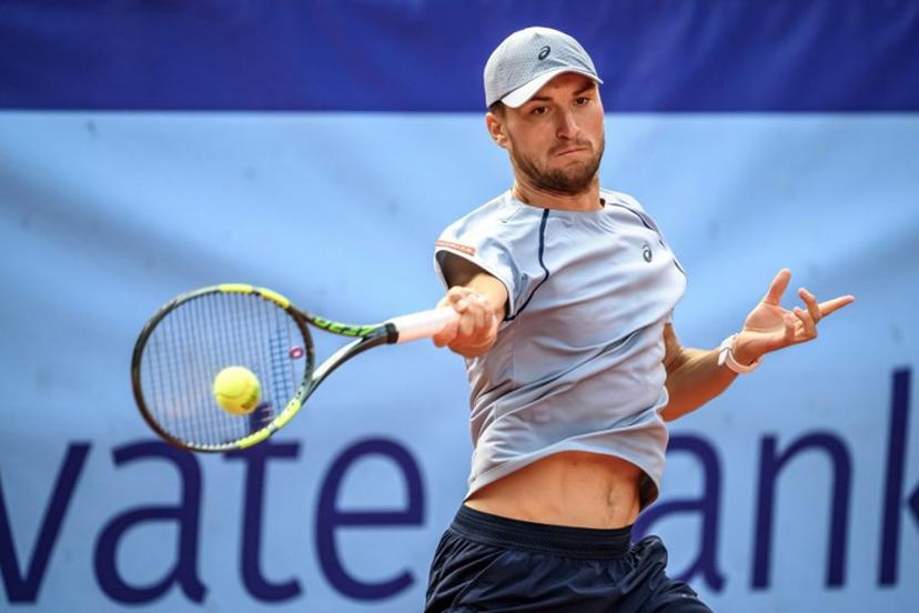 Belgium's Raphael Collignon returns the ball to Greece's Stefanos Tsitsipas during their men's singles final match at the Swiss Open tennis tournament in Gstaad, on July 19, 2026. Fabrice COFFRINI / AFP