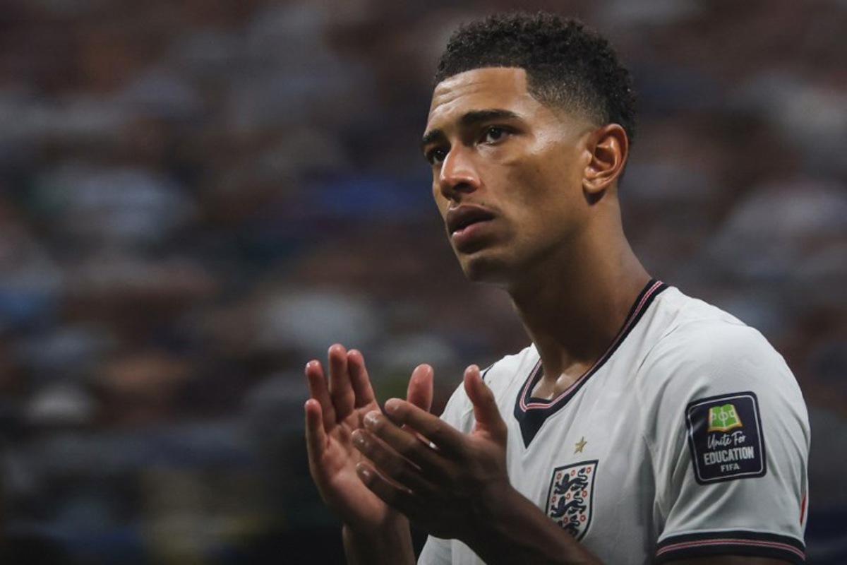 England's midfielder #10 Jude Bellingham greets fans after losing the 2026 World Cup football tournament semi-final match between England and Argentina at the Atlanta Stadium in Atlanta on July 15, 2026. Odd ANDERSEN / AFP