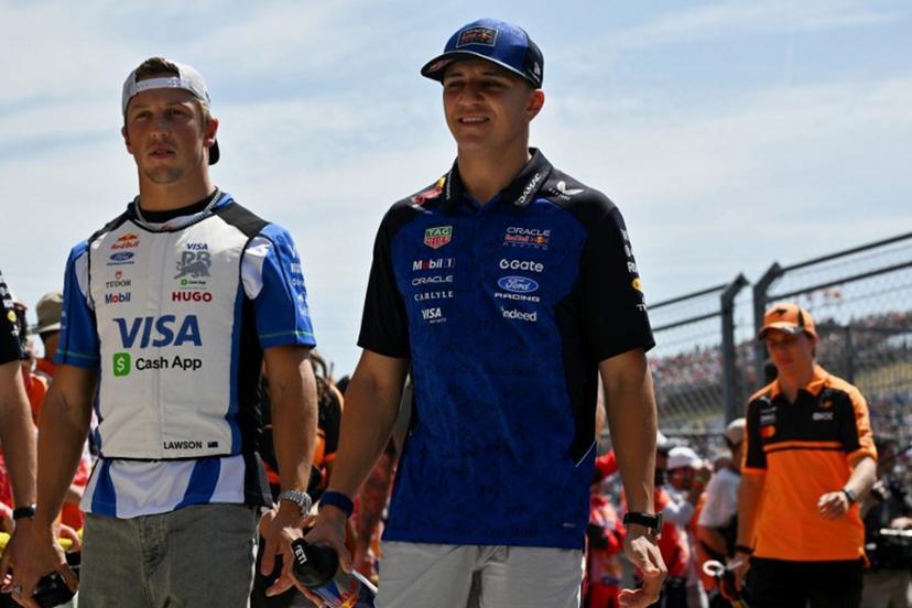 (From L) Racing Bulls' New Zealand driver Liam Lawson and Red Bull Racing's French driver Isack Hadjar arrive prior to the Formula One Hungarian Grand Prix at the Hungaroring racetrack in Mogyorod near Budapest, Hungary, on July 26, 2026. Andrej ISAKOVIC / AFP